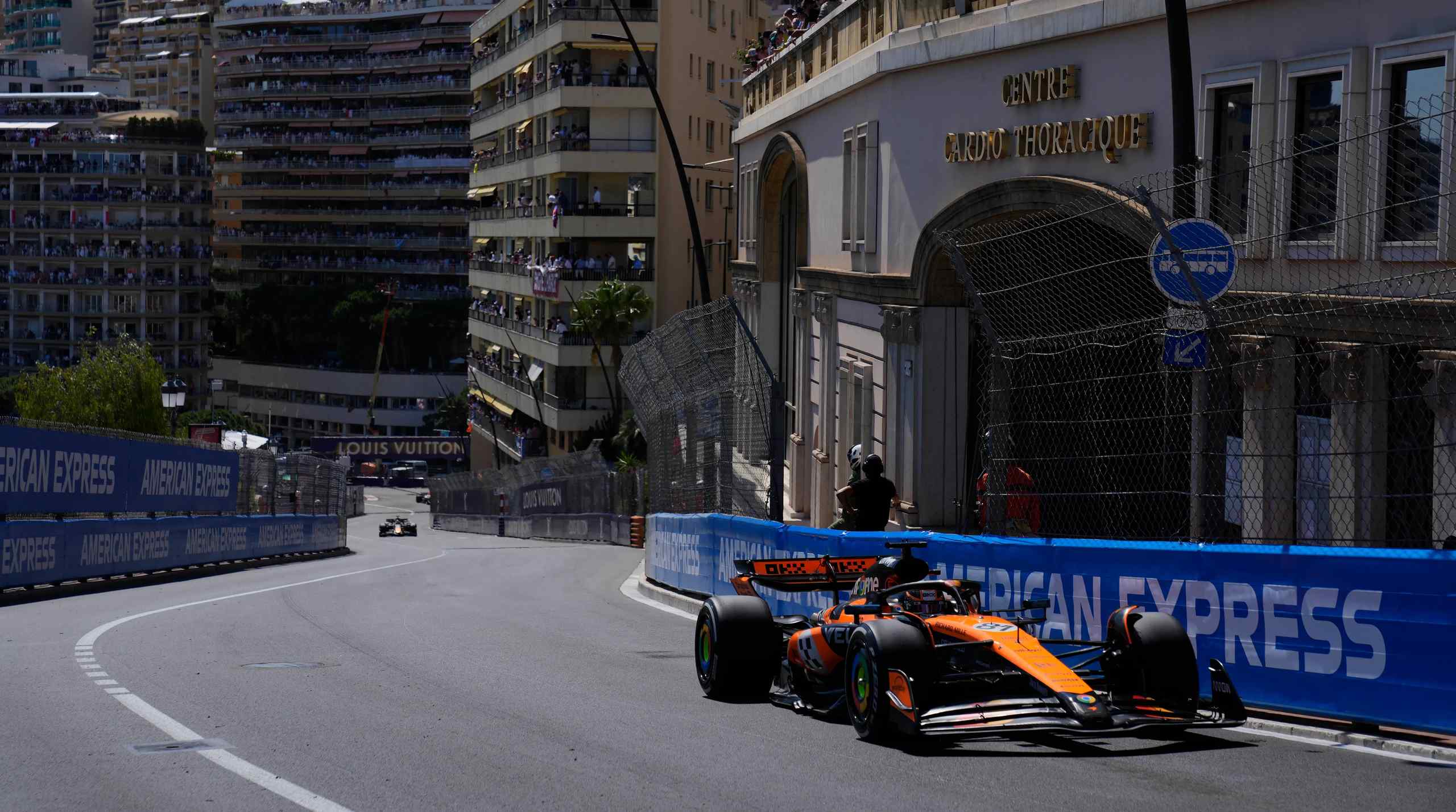 An F1 race car speeds down the streets of Monaco.